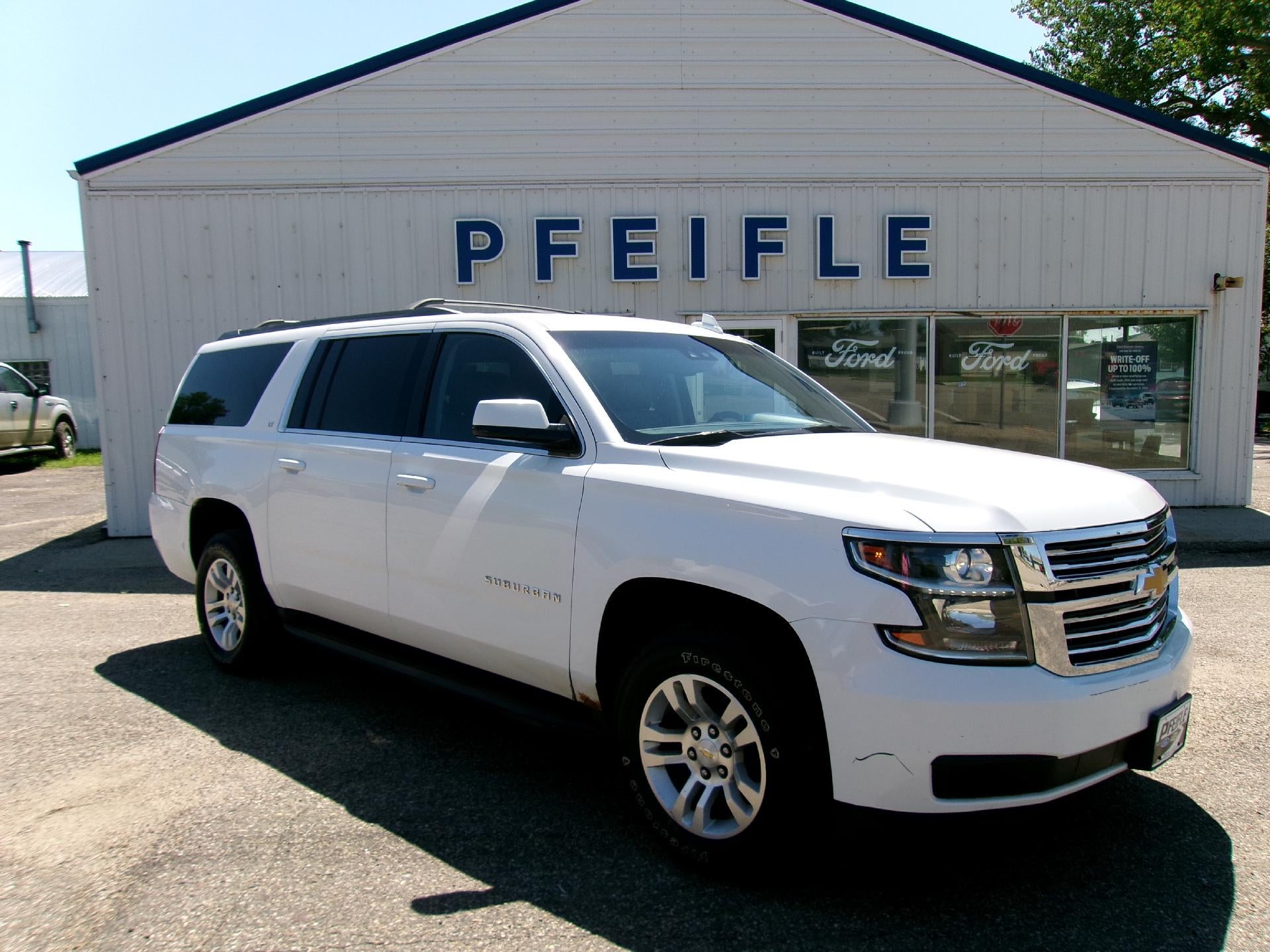 2015 Chevrolet Suburban LT in White — front three-quarter view